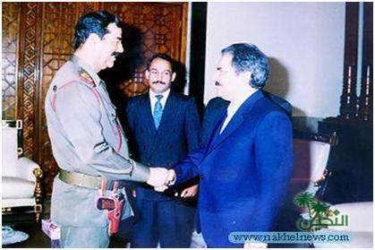 Massoud Rajavi (R) and Saddam Hussain (L).