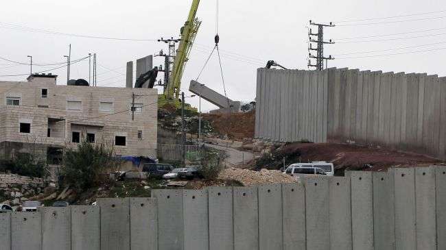 A crane completes a section of Israel