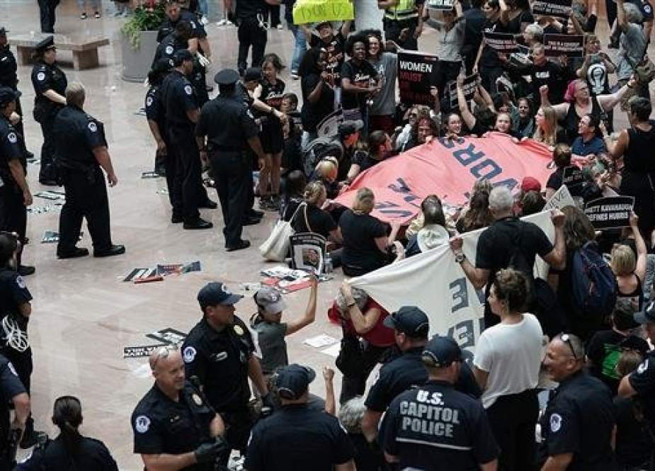 US Capitol police arrest demonstrators during a protest against the confirmation of Judge Brett Kavanaugh.jpg