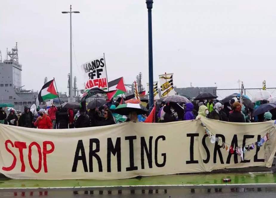 Pro-Palestine American protesters gather near the USNS Harvey Milk