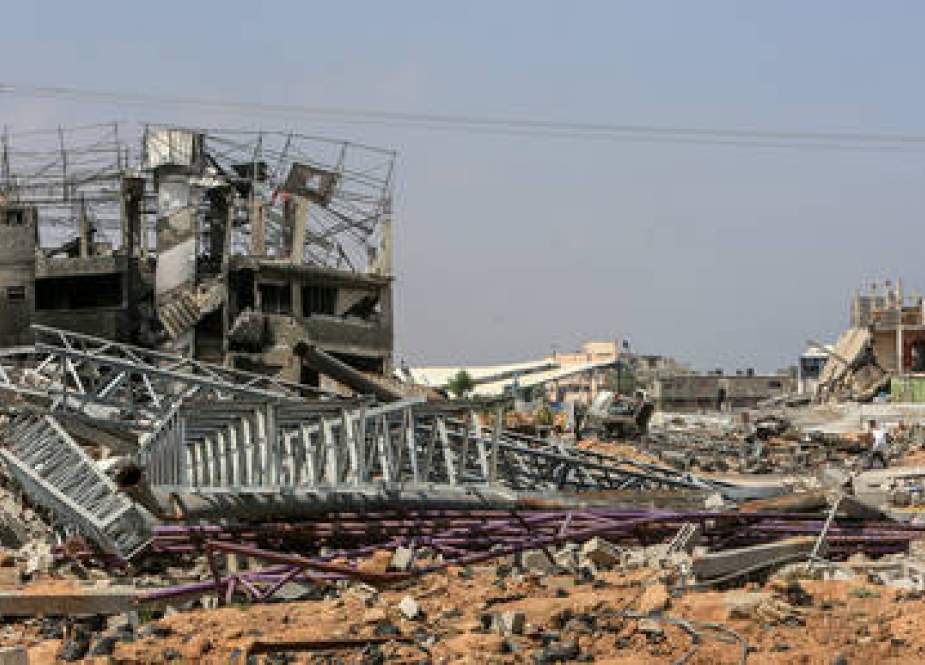 Destroyed buildings are seen after the Israeli attack on Al-Maghazi refugee camp, Gaza