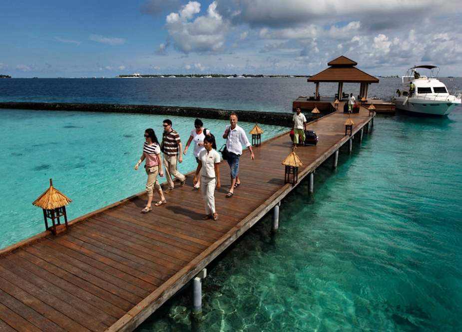 Foreign tourists arrive in a resort in the Kurumba island in Maldives
