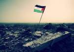 A Palestinian national flag is flying in the ruins of war-torn Gaza