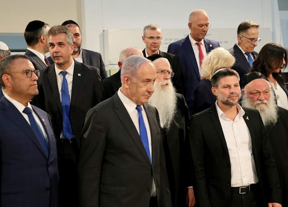 Israeli Prime Minister Benjamin Netanyahu, center, arrives at a Cabinet meeting in occupied al-Quds, occupied Palestine