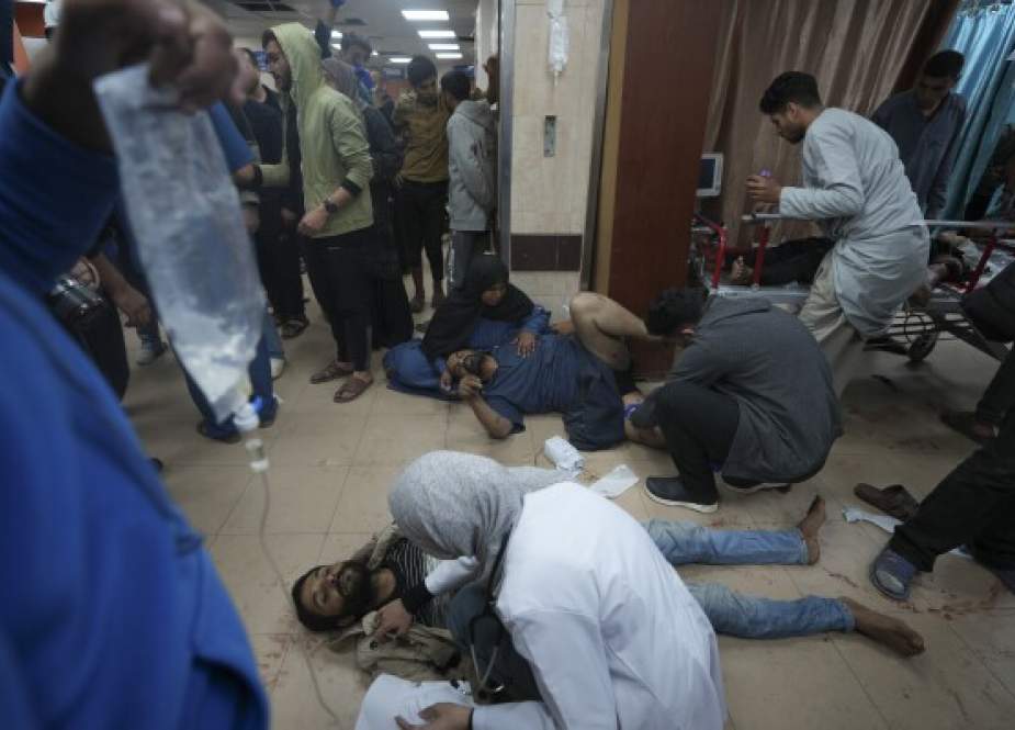 Palestinians wounded in the Israeli bombardment of the Gaza Strip are treated at Al-Aqsa Hospital in Deir el-Balah