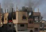 Bangunan-bangunan yang terbakar dan rusak akibat serangan Israel di kamp pengungsi Nuseirat di Jalur Gaza