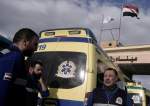 Egyptian ambulance drivers, carrying bodies of Palestinians who died at Egyptian hospital