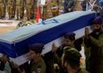 Israeli soldiers carry the flag-draped casket of an IOF soldier who was killed during the Israeli ground invasion of the Gaza Strip