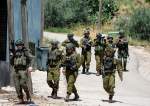 Israeli occupation forces march in the Palestinians Al Fara