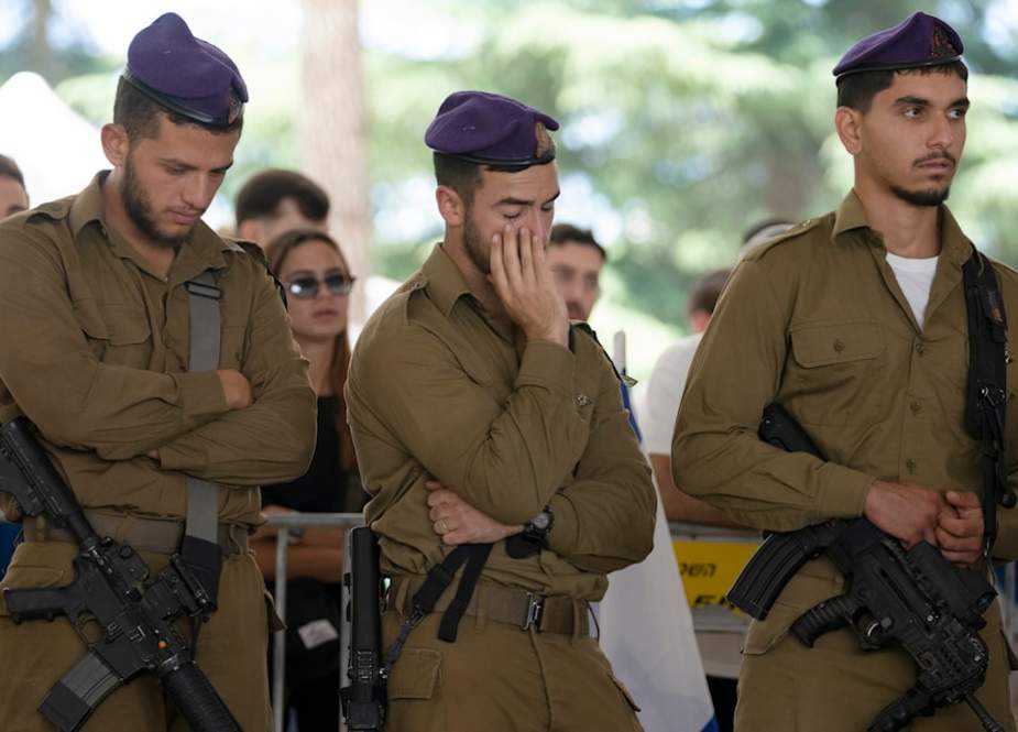 Israeli occupation soldiers from the Givati Brigade attend the funeral for Sgt. Yonatan Elias, who was killed in action in the Gaza Strip