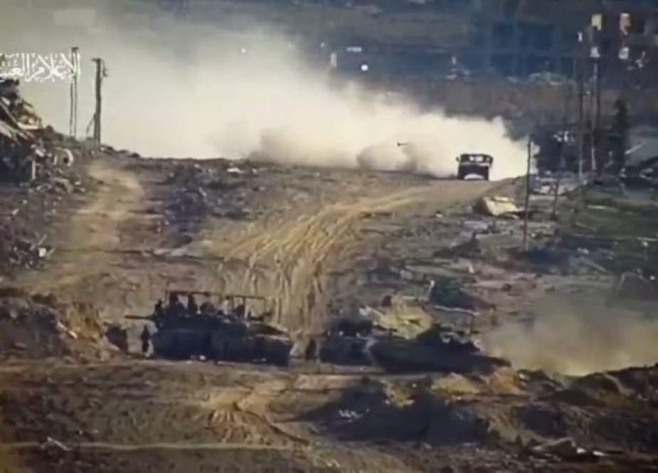 Israeli occupation forces and military vehicles moments before being targeted by al-Qassam Brigades at the al-Nablusi Junction in Tal al-Hawa, west of Gaza City