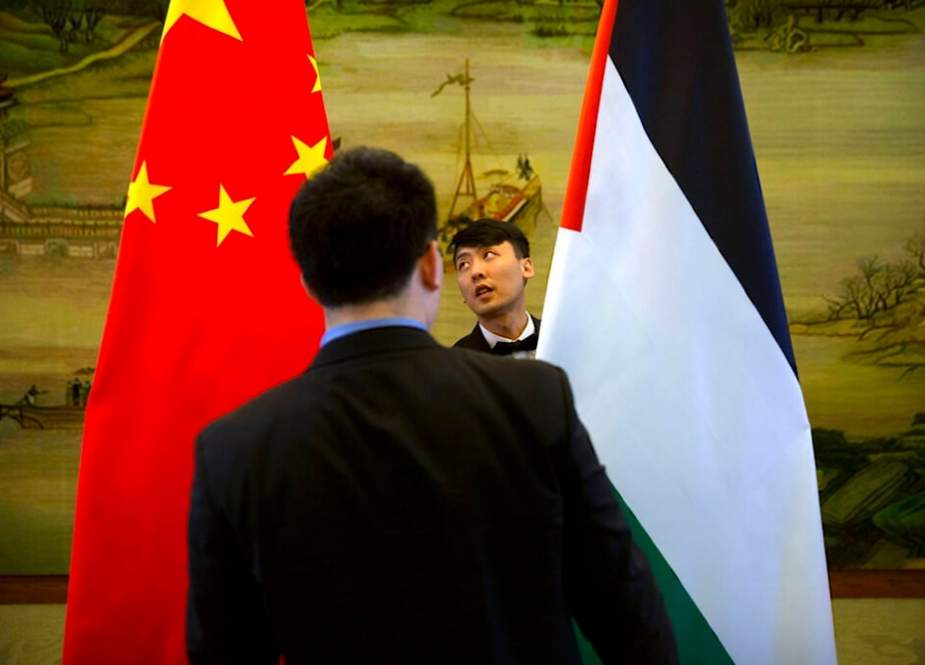 Chinese, left, and Palestinian flags before the start of a joint press conference at the Ministry of Foreign Affairs in Beijing