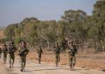 Israeli occupation soldiers are seen near the Gaza Strip border in southern occupied Palestine