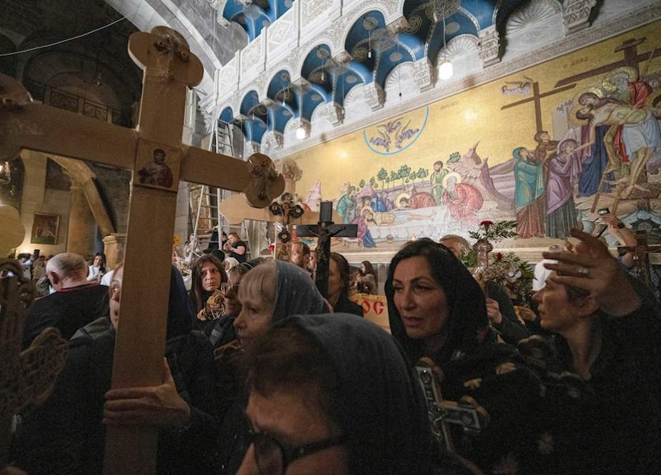Orthodox Christians walk the Way of the Cross procession that commemorates Jesus Christ