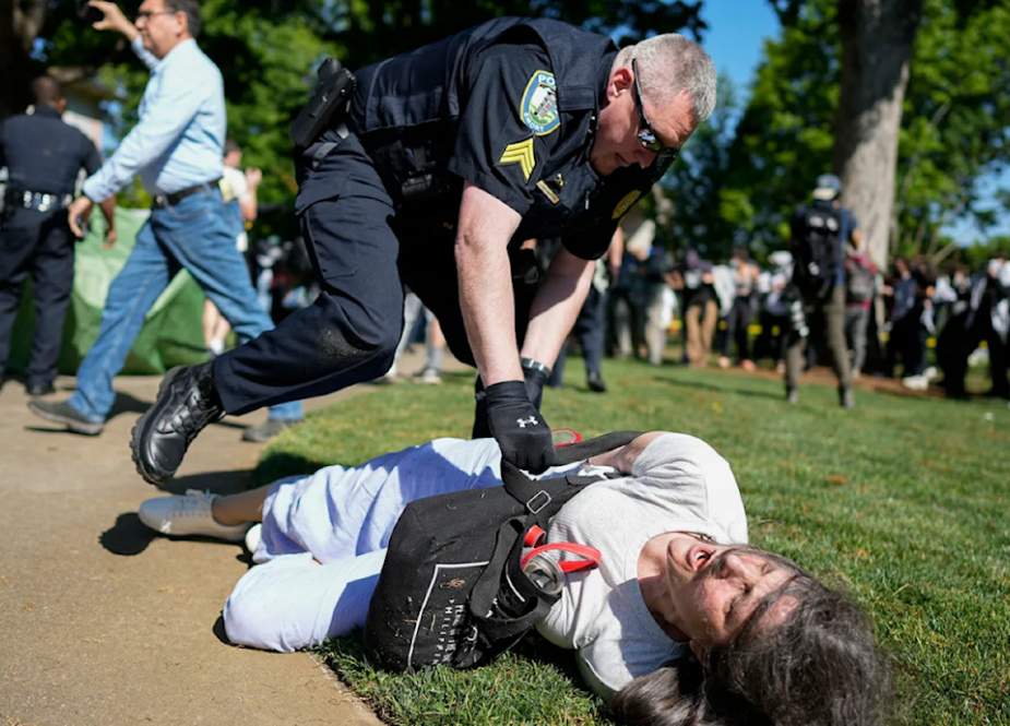 A-police-officer-detains-a-protester-on-the-campus-of-Emory-University-during-a-pro-Palestine-demons
