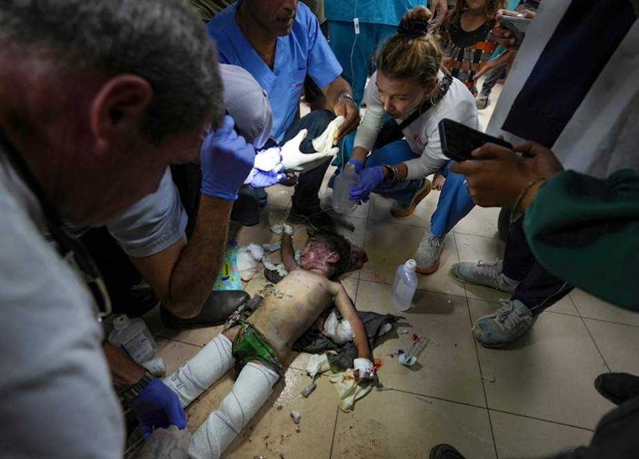 Medics treat a child from an Israeli bombardment of the Nuseirat refugee camp at the Al-Aqsa Martyrs Hospital in Deir al-Balah, Gaza Strip