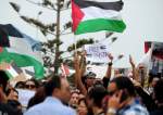 Tunisians demonstrate during a rally in solidarity with the Palestinian people in Gaza, outside the U.S. embassy in the Berges du Lac, outside Tunis