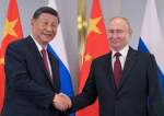 Russian President Vladimir Putin and Chinese President Xi Jinping shake hands during the SCO summit in Astana, Kazakhstan