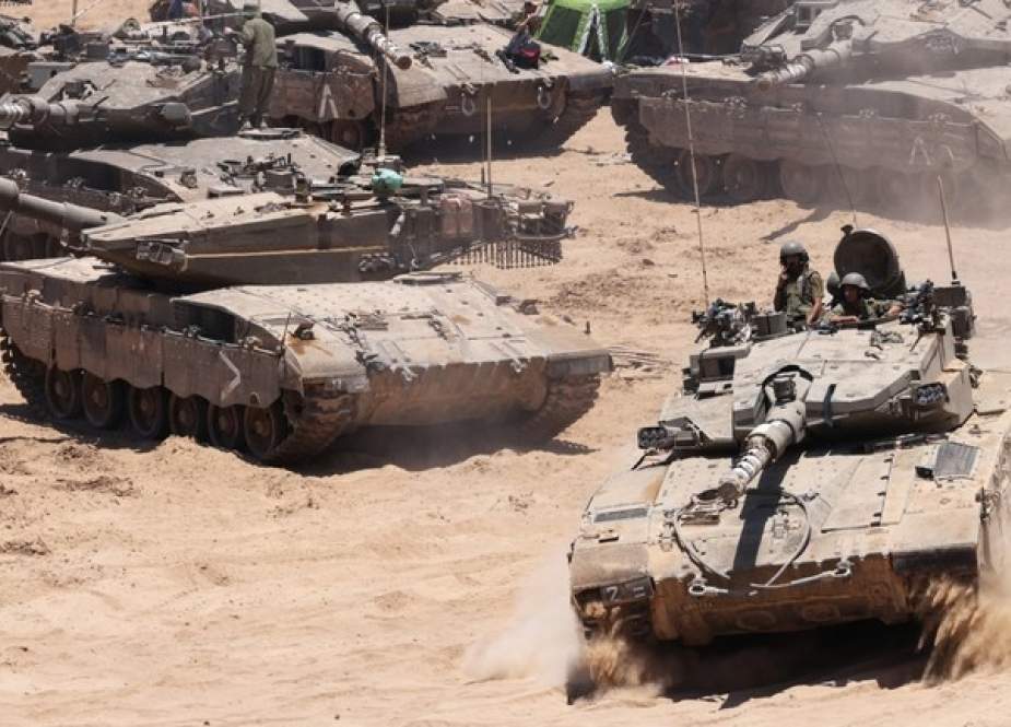 Israeli army tanks deploy in an area of Israel