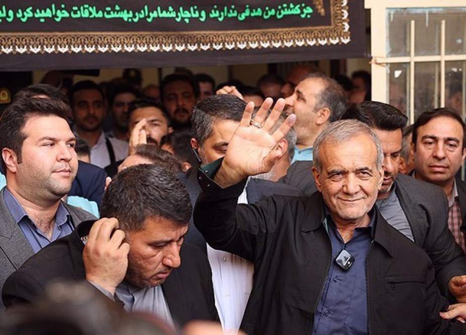 Masoud Pezeshkian is seen among people after casting his vote at a polling station in Qaleh Hassan Khan, west of Tehran