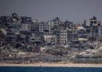Destroyed buildings stand in the coast of the Gaza Strip