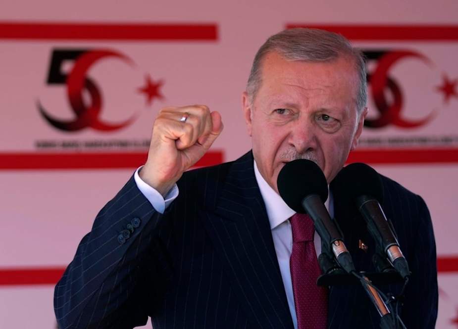 Turkish President Recep Tayyip Erdogan talks during a military parade, in the Turkish part of the divided capital Nicosia, Cyprus