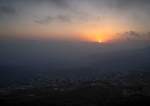 The sun sets behind the mountains next to the settlements of Kiryat Shmona and Metula