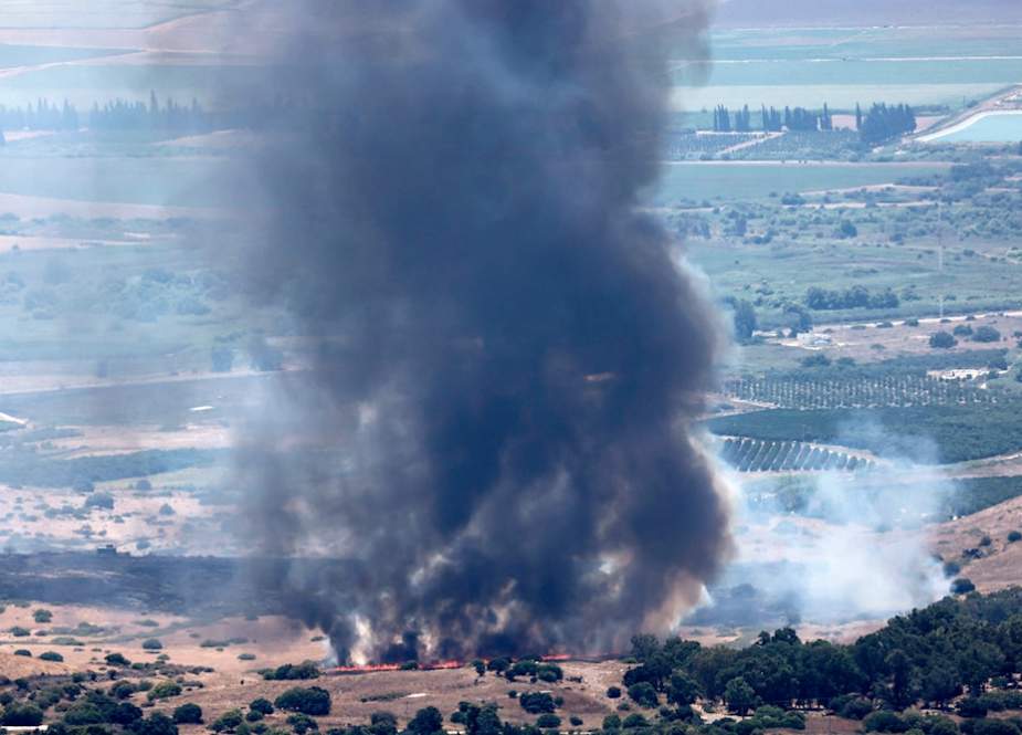 Smoke billows after a hit from a rocket fired from southern Lebanon over the Upper al-Jalil region in northern occupied Palestine